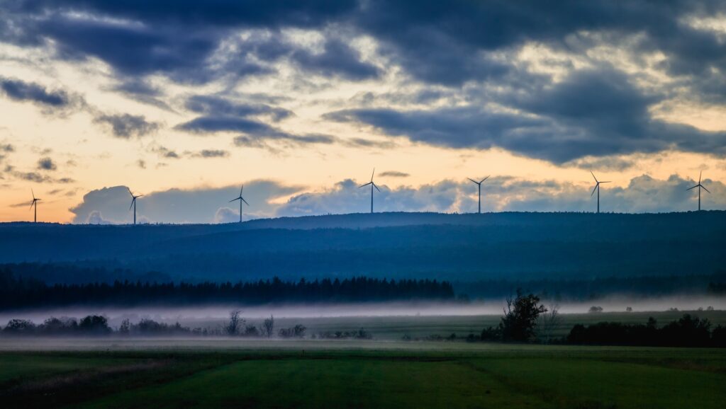 Picturesque view of fields in fog